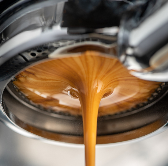 low-angle-view-coffee-pouring 1